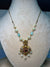 Mid length golden chain with locket