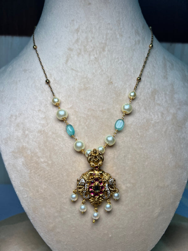 Mid length golden chain with locket