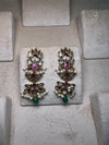 Golden earrings with pink meenakari and green beads