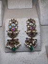 Golden earrings with pink meenakari and green beads