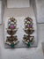 Golden earrings with pink meenakari and green beads