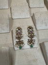 Golden earrings with pink meenakari and green beads