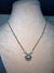Golden chain with baby blue stone